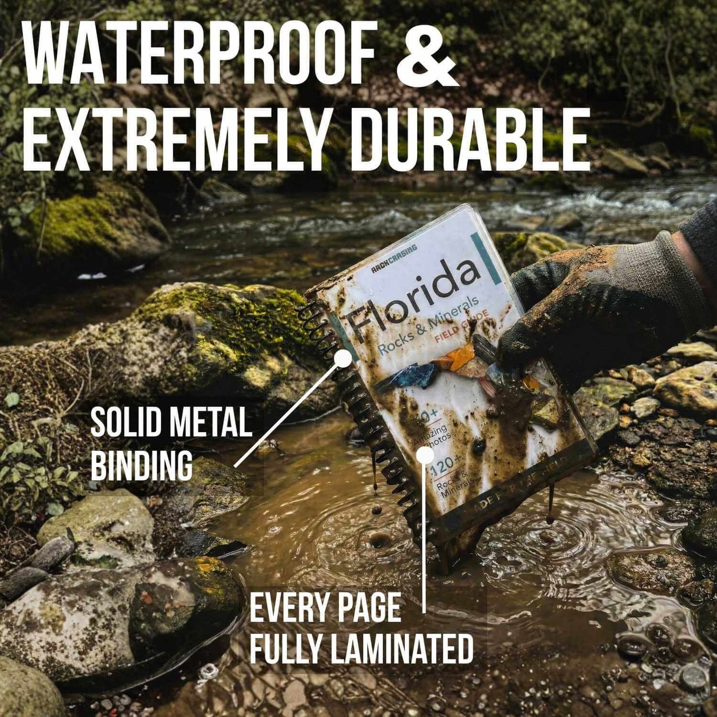 Person holding a waterproof map by a stream with text highlighting features.