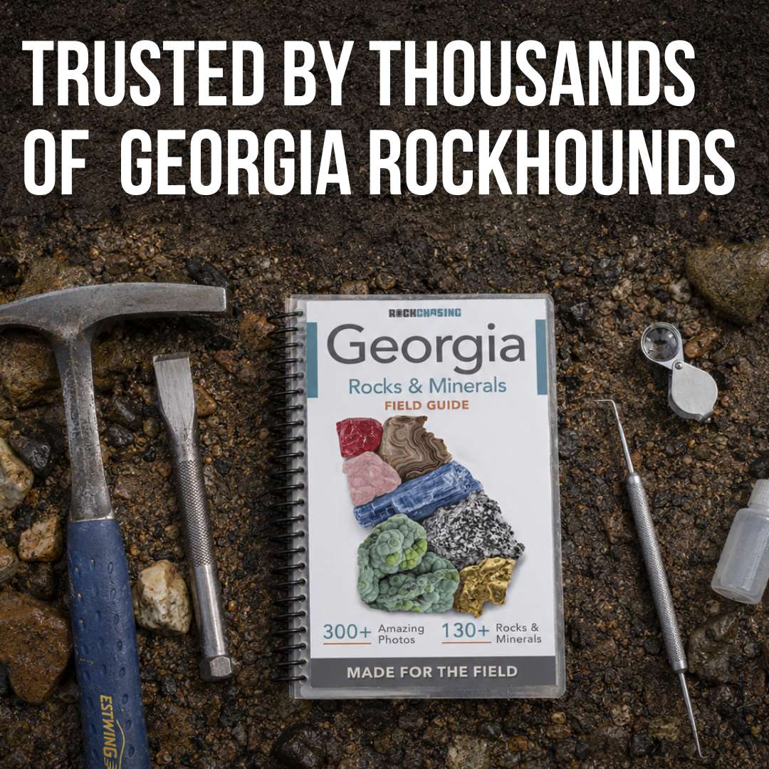 The field guide next to several other common rock hunting tools
